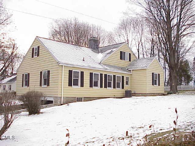 6 Lakeview Road Brookfield, CT 06804 - Photo 1 of 1 a front view of a house with a yard covered in snow