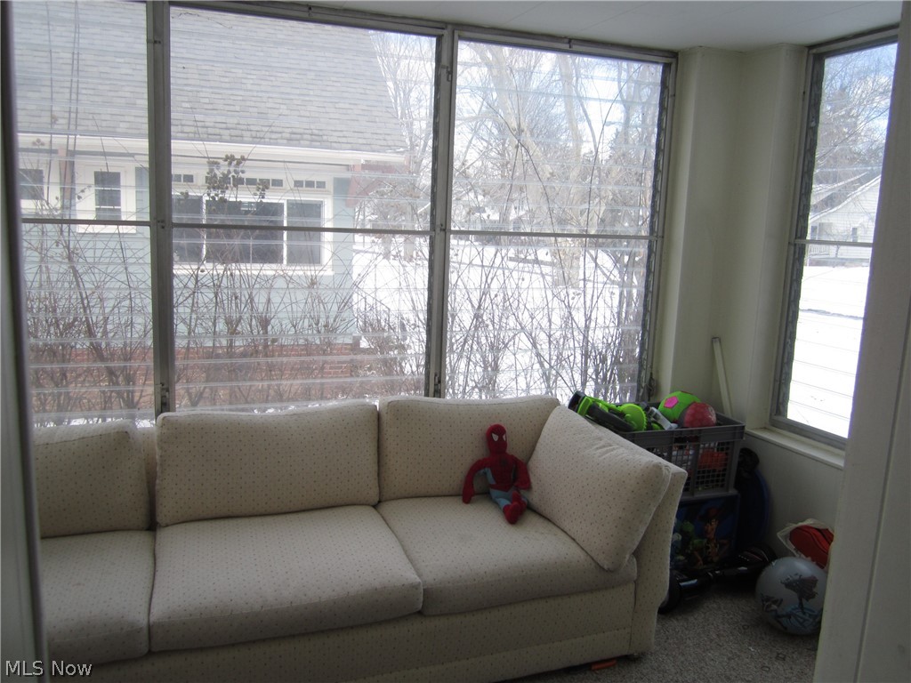 906 Montford Road Cleveland Heights, OH 44121 - Photo 5 of 20 Sunroom surrounded by windows.
