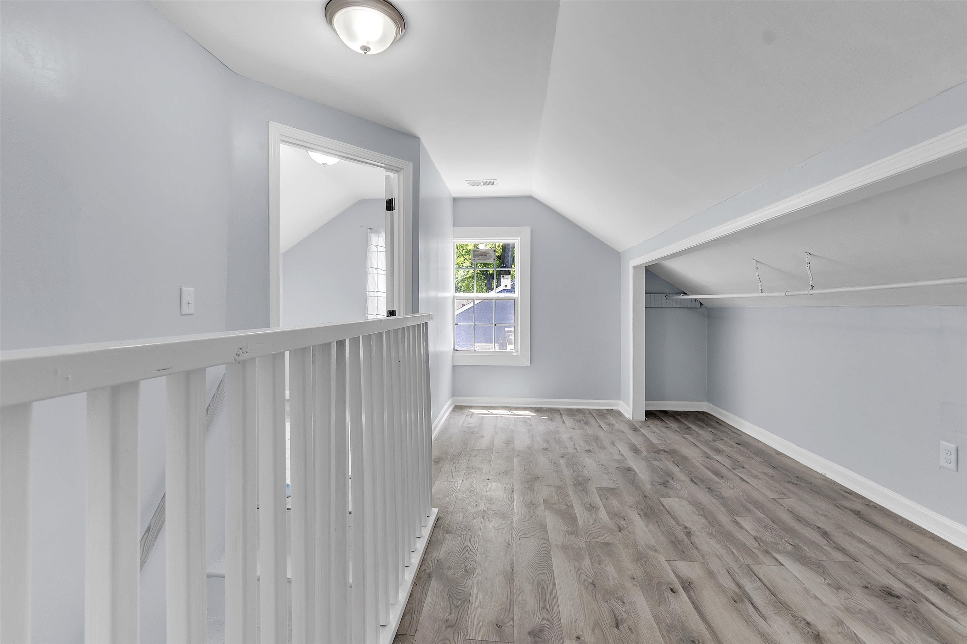 1682 Pendleton Street Memphis, TN 38114 - Photo 15 of 36 a view of an empty room with wooden floor