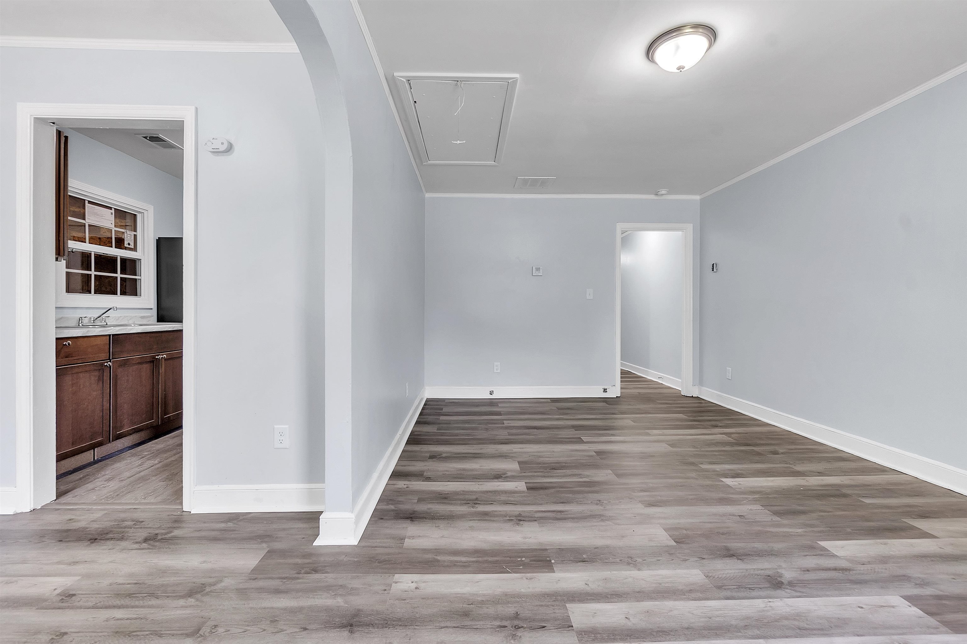 1682 Pendleton Street Memphis, TN 38114 - Photo 19 of 36 a view of an empty room and wooden floor