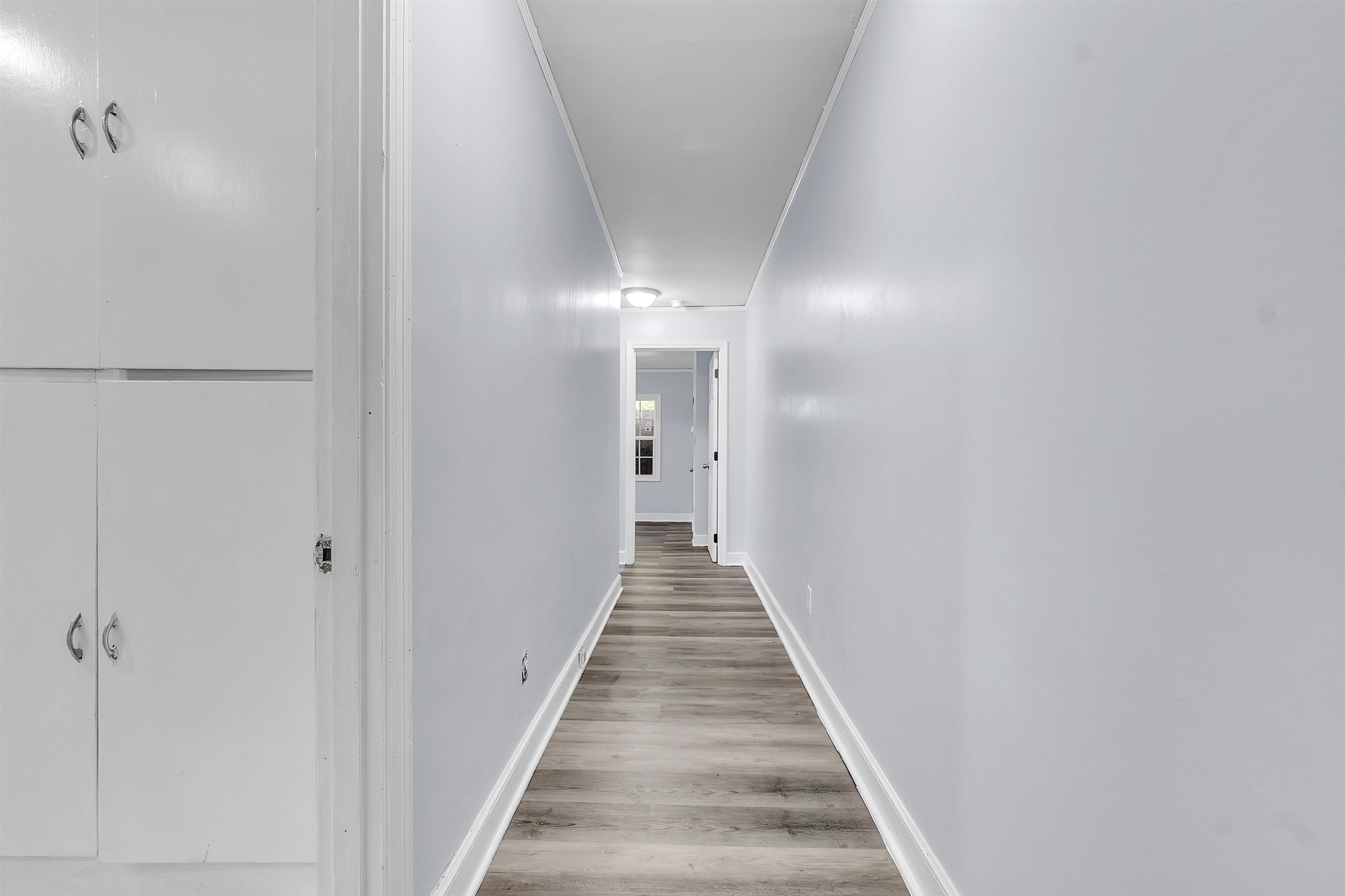 1682 Pendleton Street Memphis, TN 38114 - Photo 20 of 36 a view of a hallway with wooden floor and staircase
