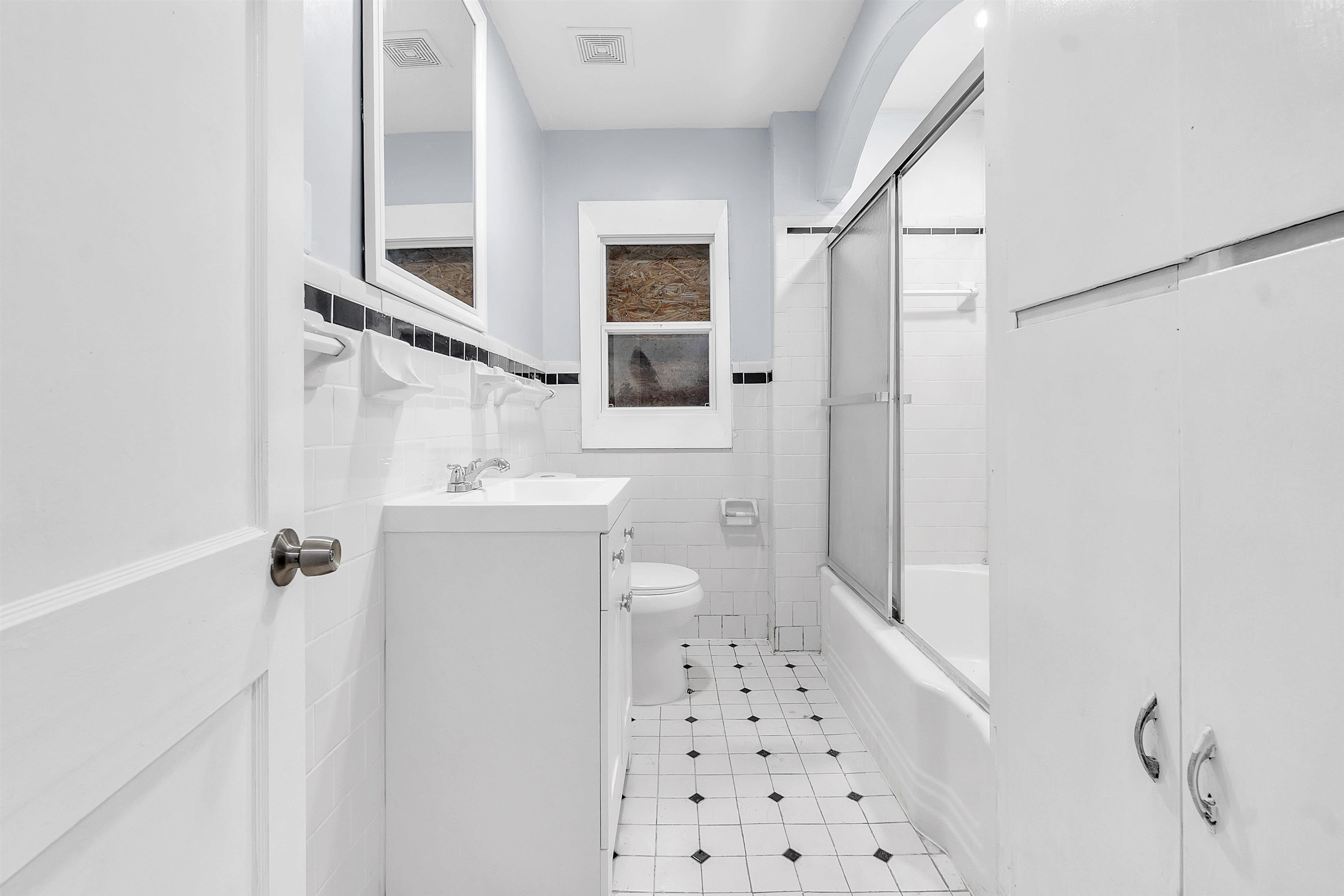 1682 Pendleton Street Memphis, TN 38114 - Photo 21 of 36 a bathroom with a sink a toilet a shower and a mirror