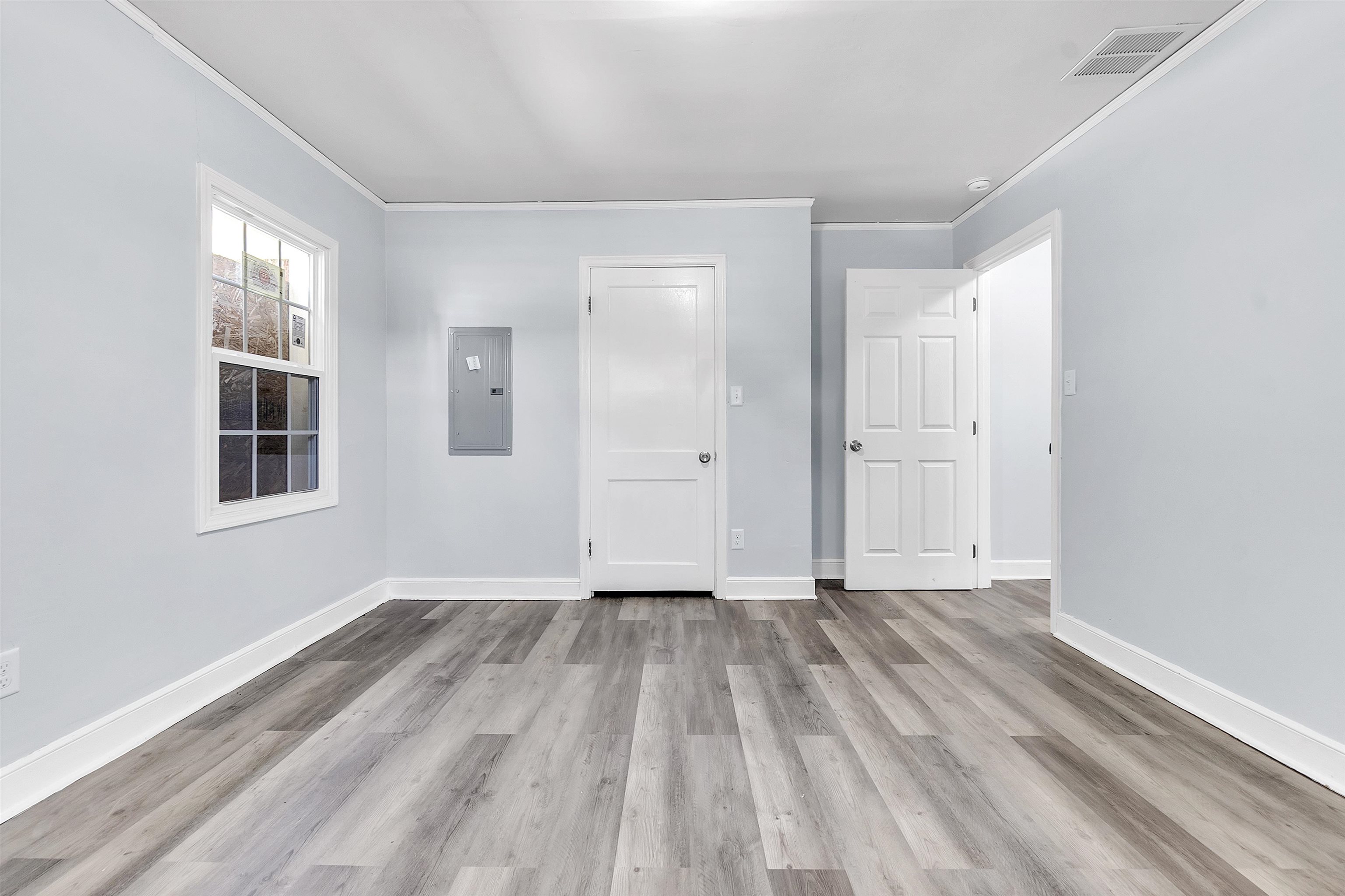 1682 Pendleton Street Memphis, TN 38114 - Photo 23 of 36 wooden floor in an empty room with a window