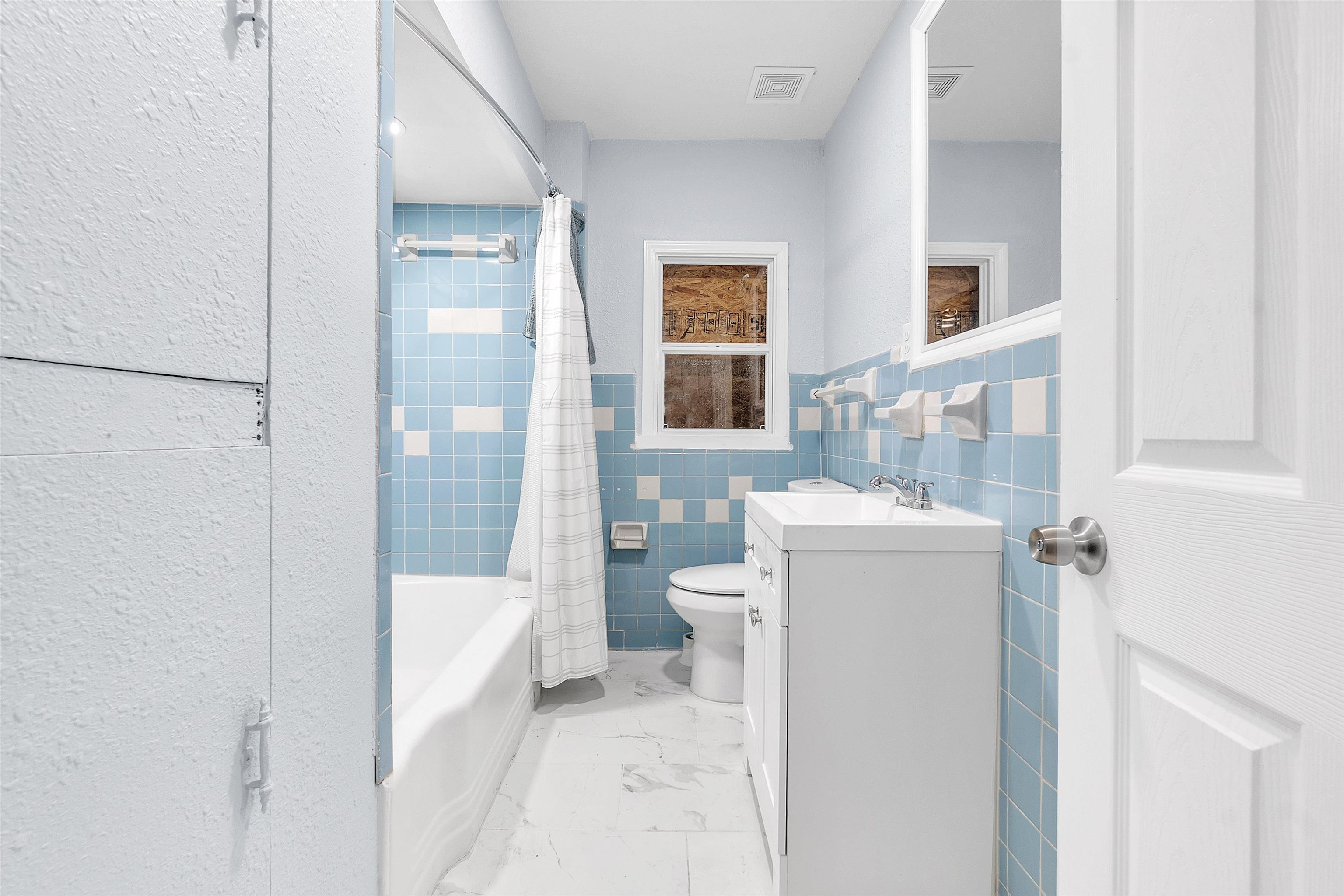 1682 Pendleton Street Memphis, TN 38114 - Photo 32 of 36 a bathroom with a sink a toilet and shower