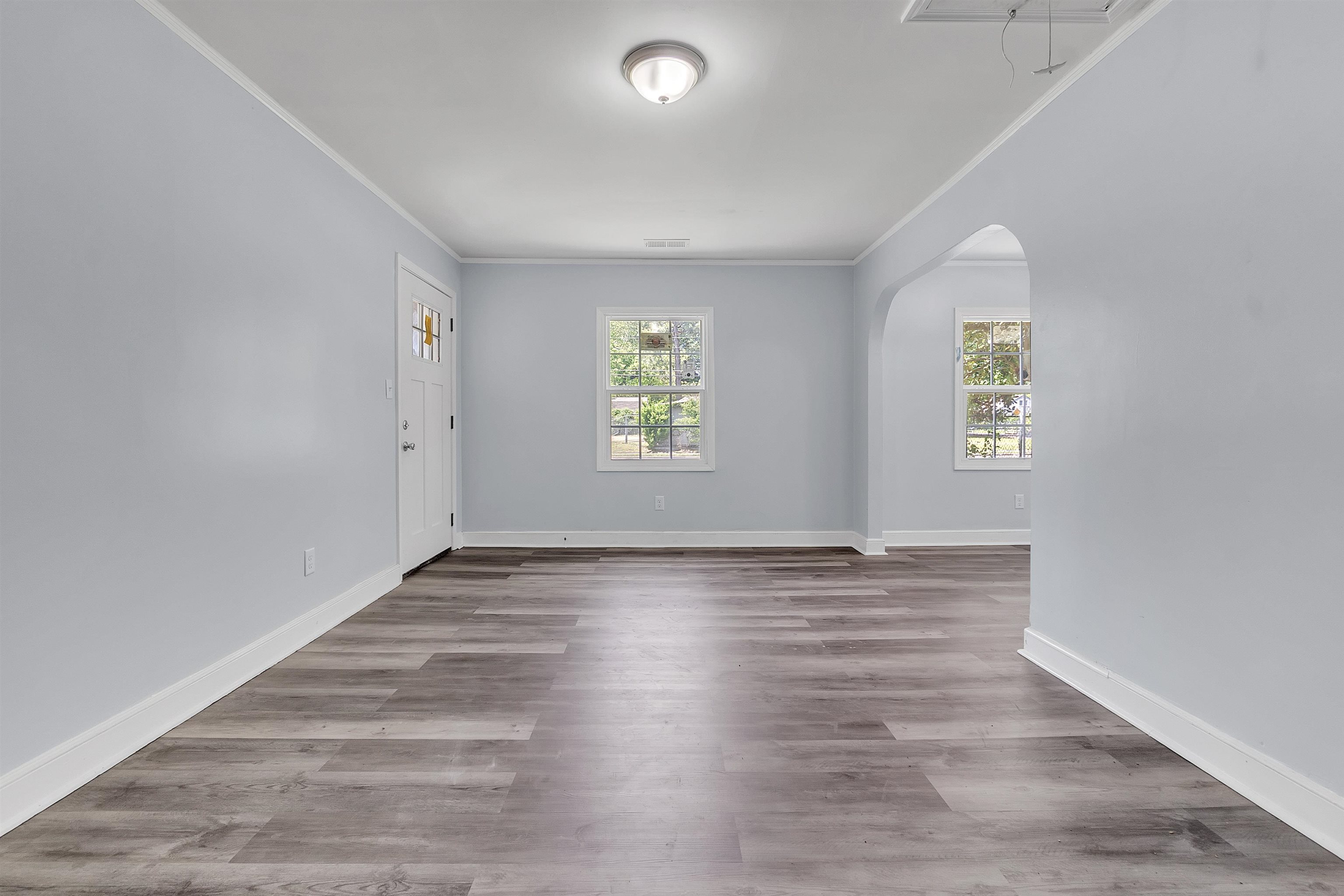 1682 Pendleton Street Memphis, TN 38114 - Photo 8 of 36 wooden floor in an empty room with window