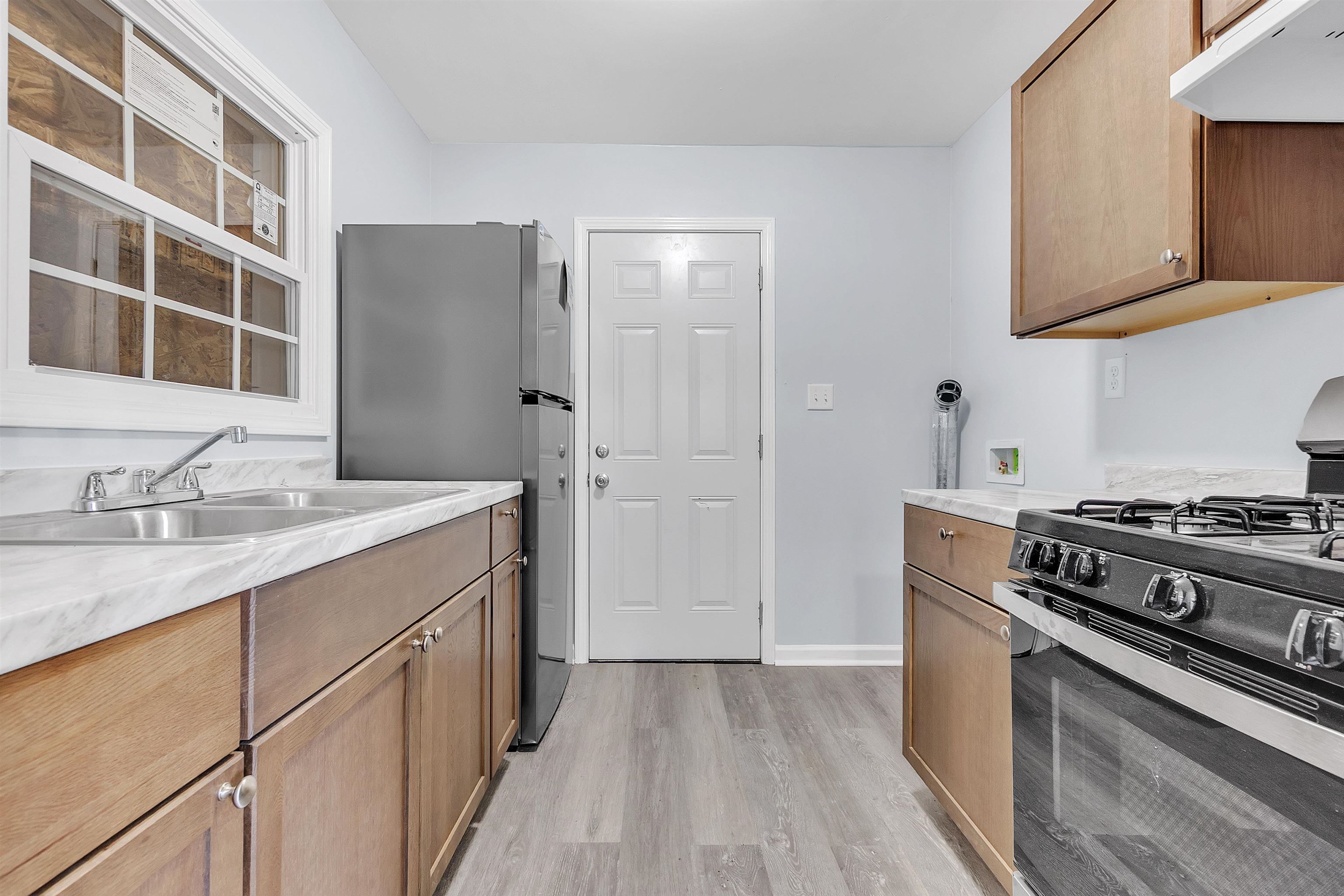 1682 Pendleton Street Memphis, TN 38114 - Photo 9 of 36 a kitchen with a stove and a refrigerator