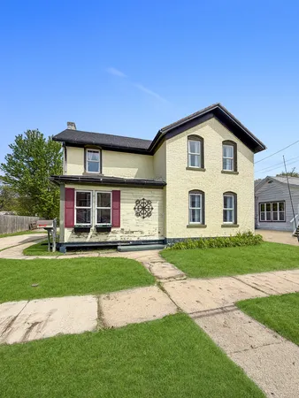a front view of a house with a yard