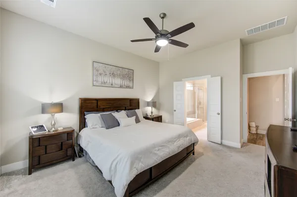 a bedroom with bed and window