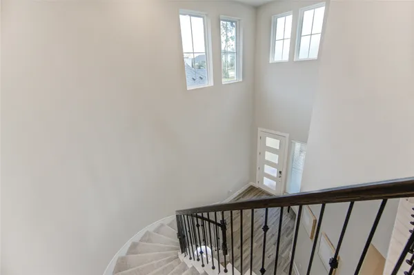 a view of a hallway with windows