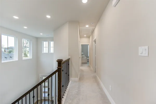 a view of a hallway with windows