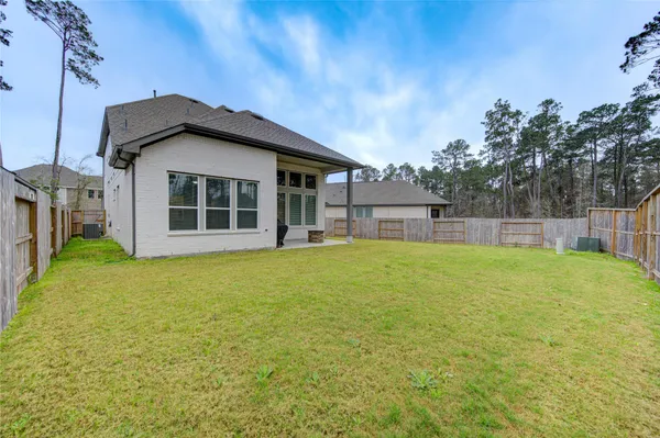 a house view with swimming pool in front of it