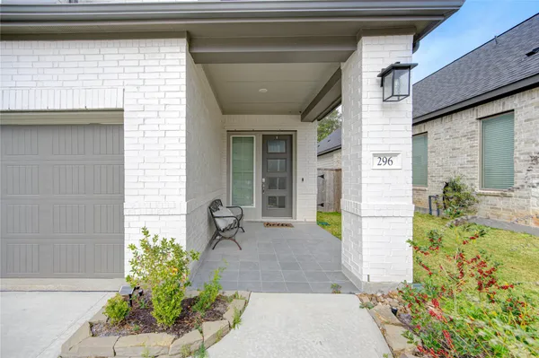 a front view of a house with outdoor seating