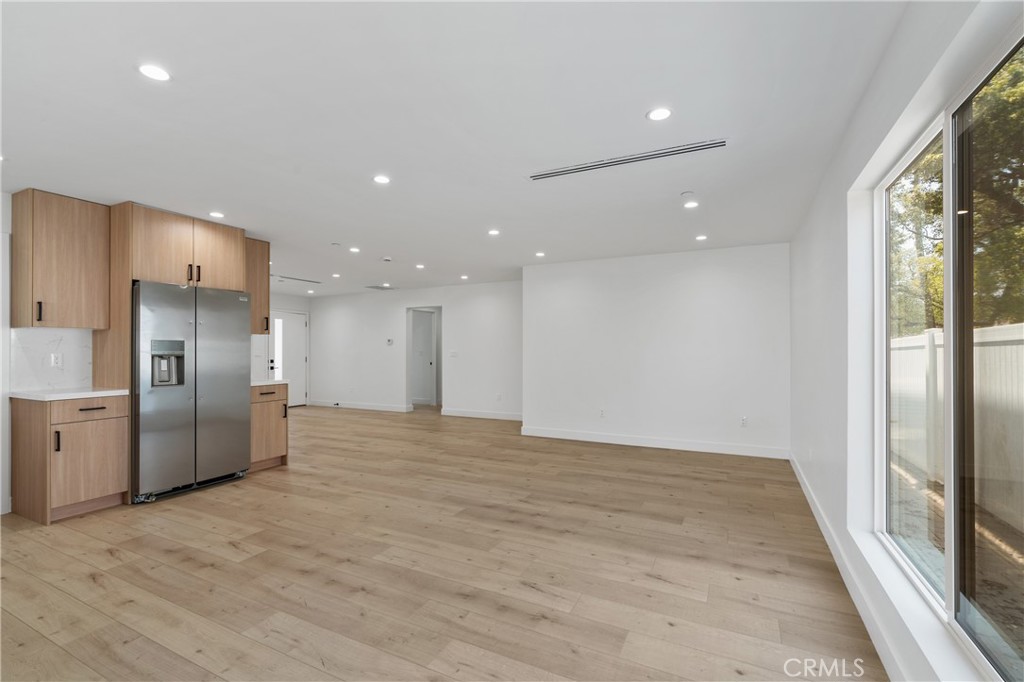 13901 Runnymede Street Van Nuys, CA 91405 - Photo 13 of 47 a view of empty room with wooden floor and windows