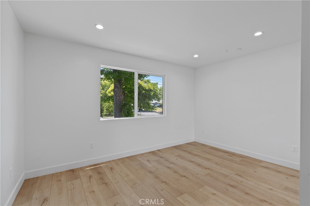 13901 Runnymede Street Van Nuys, CA 91405 - Photo 21 of 47 wooden floor in an empty room with a window