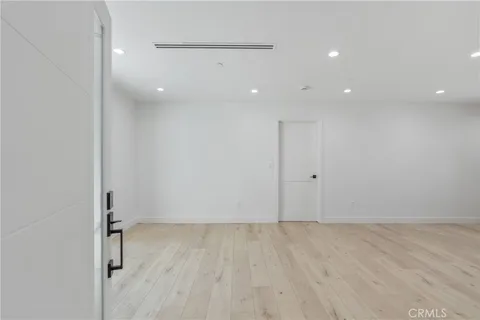 a view of a kitchen with a sink and cabinets