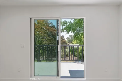 a balcony with wooden floor and fence