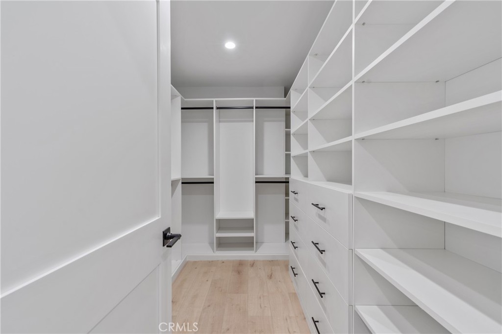 13901 Runnymede Street Van Nuys, CA 91405 - Photo 31 of 47 a view of walk in closet with empty racks
