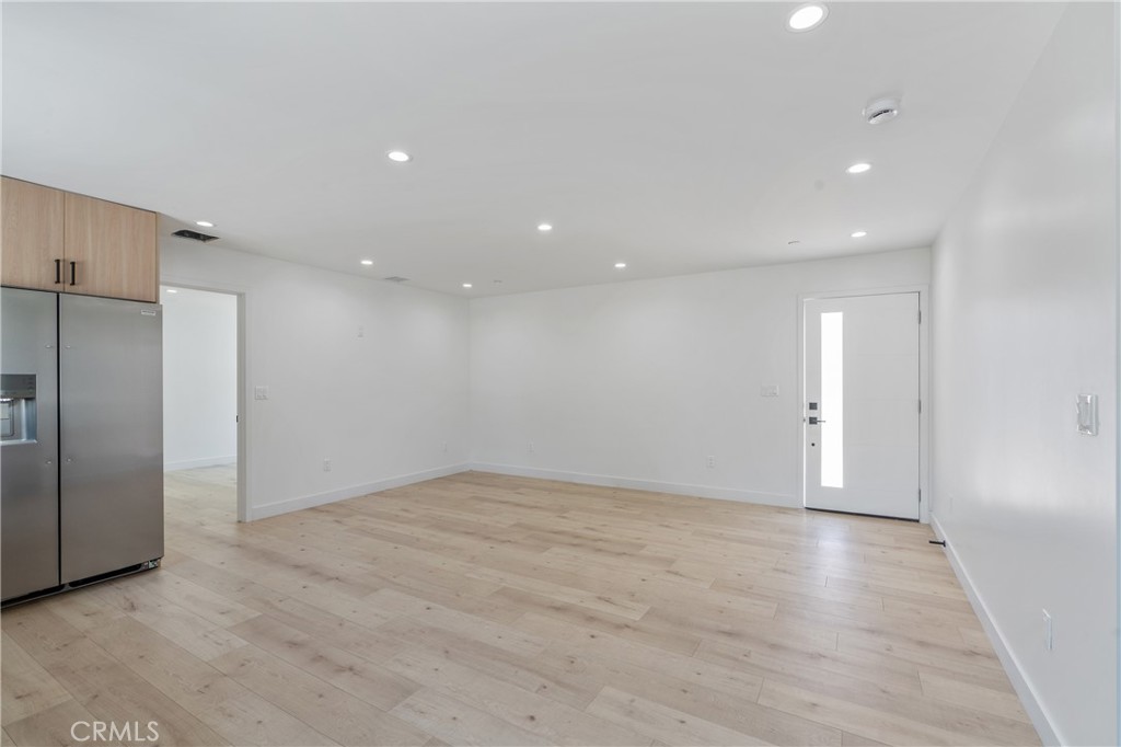 13901 Runnymede Street Van Nuys, CA 91405 - Photo 47 of 47 an empty room with wooden floor and windows