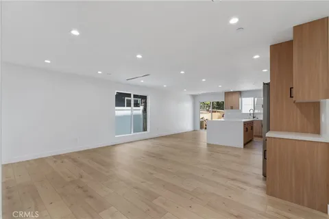 a view of kitchen and kitchen with stainless steel appliances