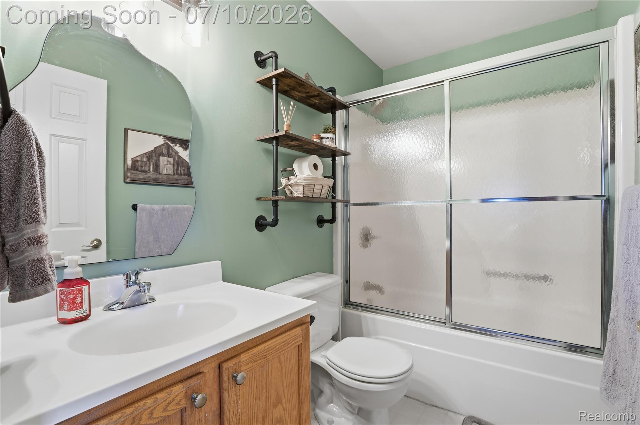 5275 East Maple Avenue Grand Blanc, MI 48439 - Photo 17 of 53 Bathroom featuring a white vanity with wood-finish cabinetry, a white countertop, and a chrome faucet