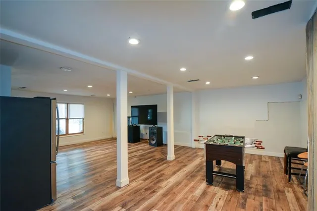 a lobby with furniture and wooden floor