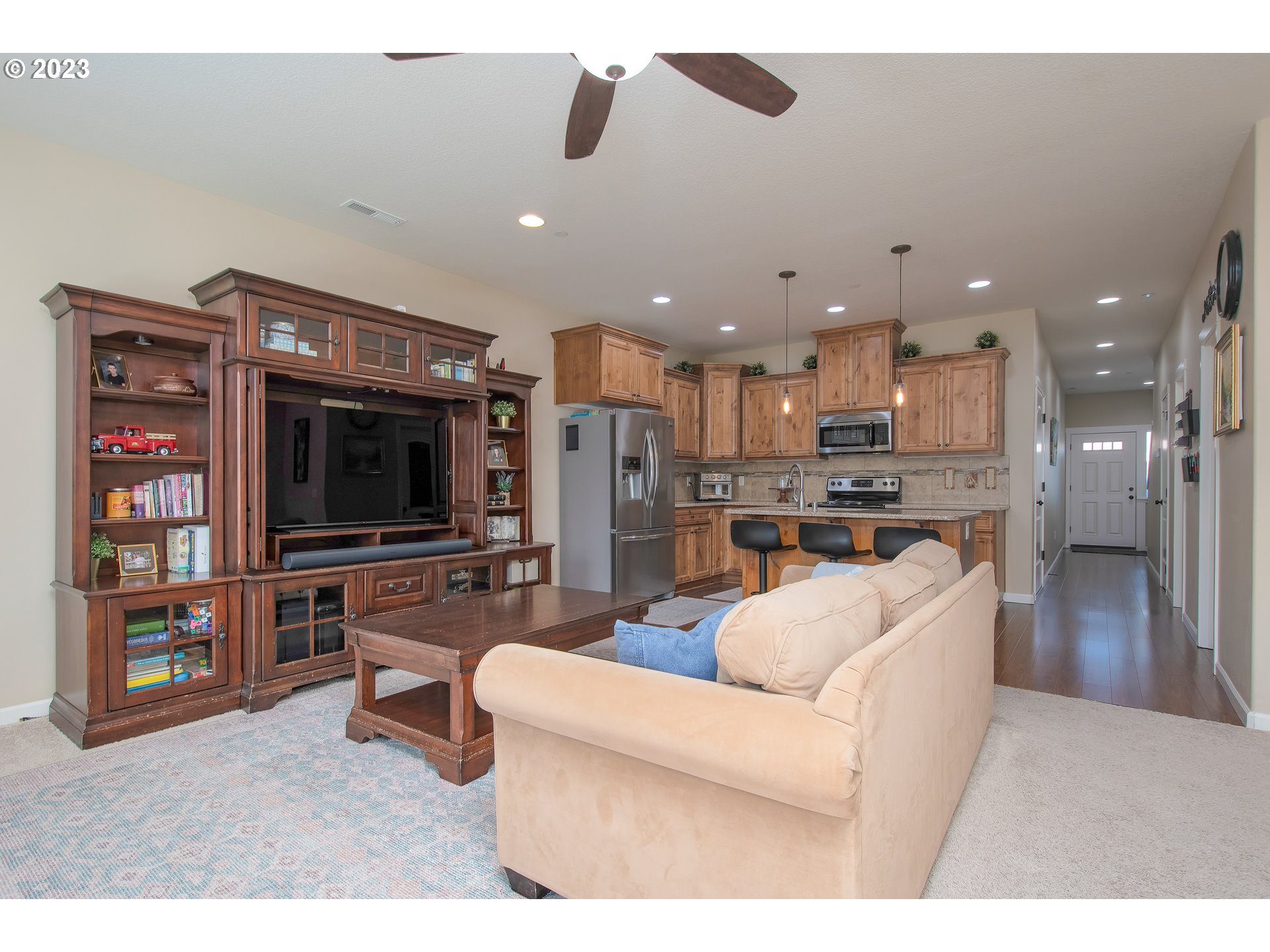 3309 North 3rd Street Ridgefield, WA 98642 - Photo 12 of 36 a living room with furniture and a flat screen tv