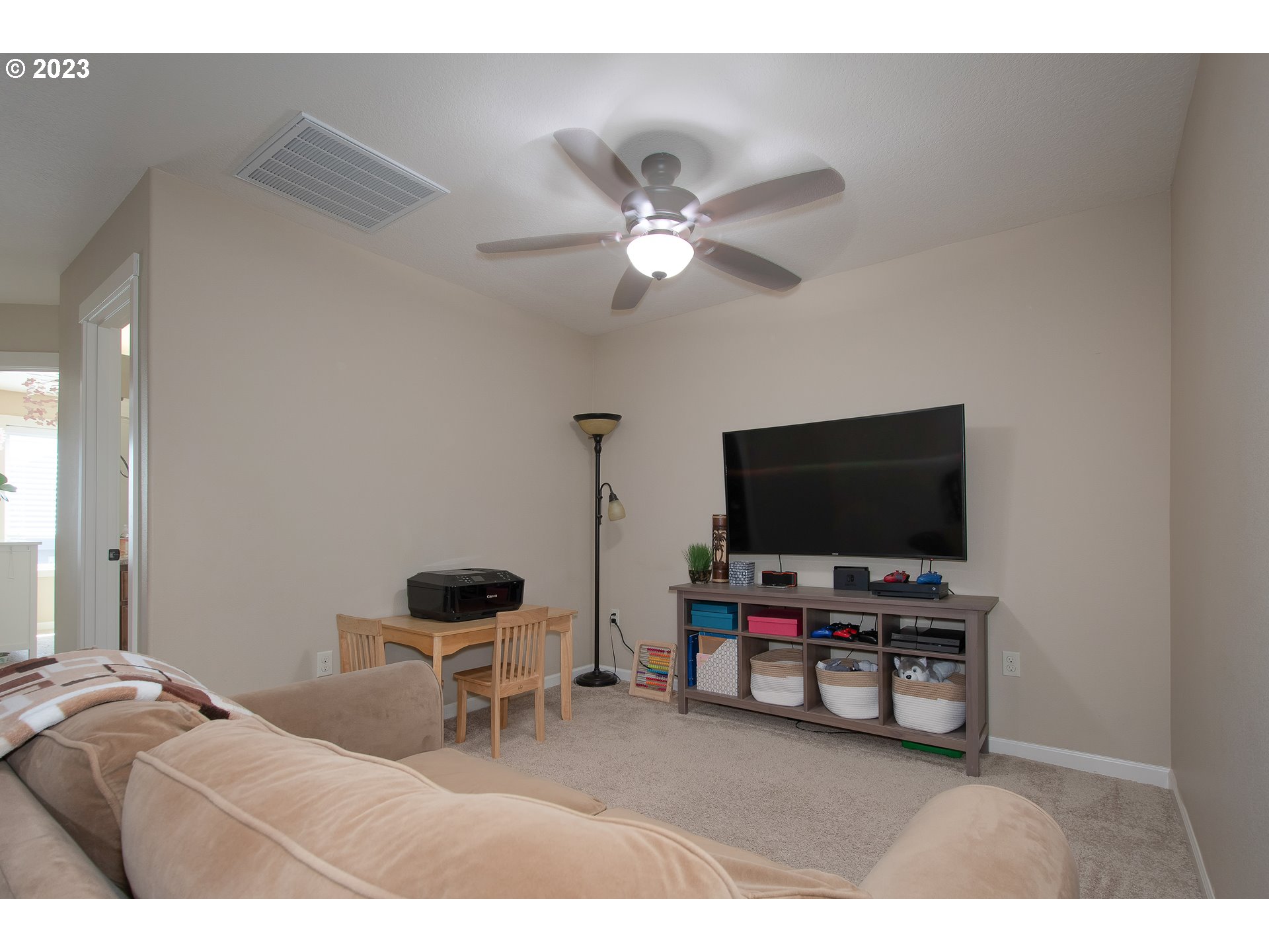 3309 North 3rd Street Ridgefield, WA 98642 - Photo 18 of 36 a living room with furniture and a flat screen tv