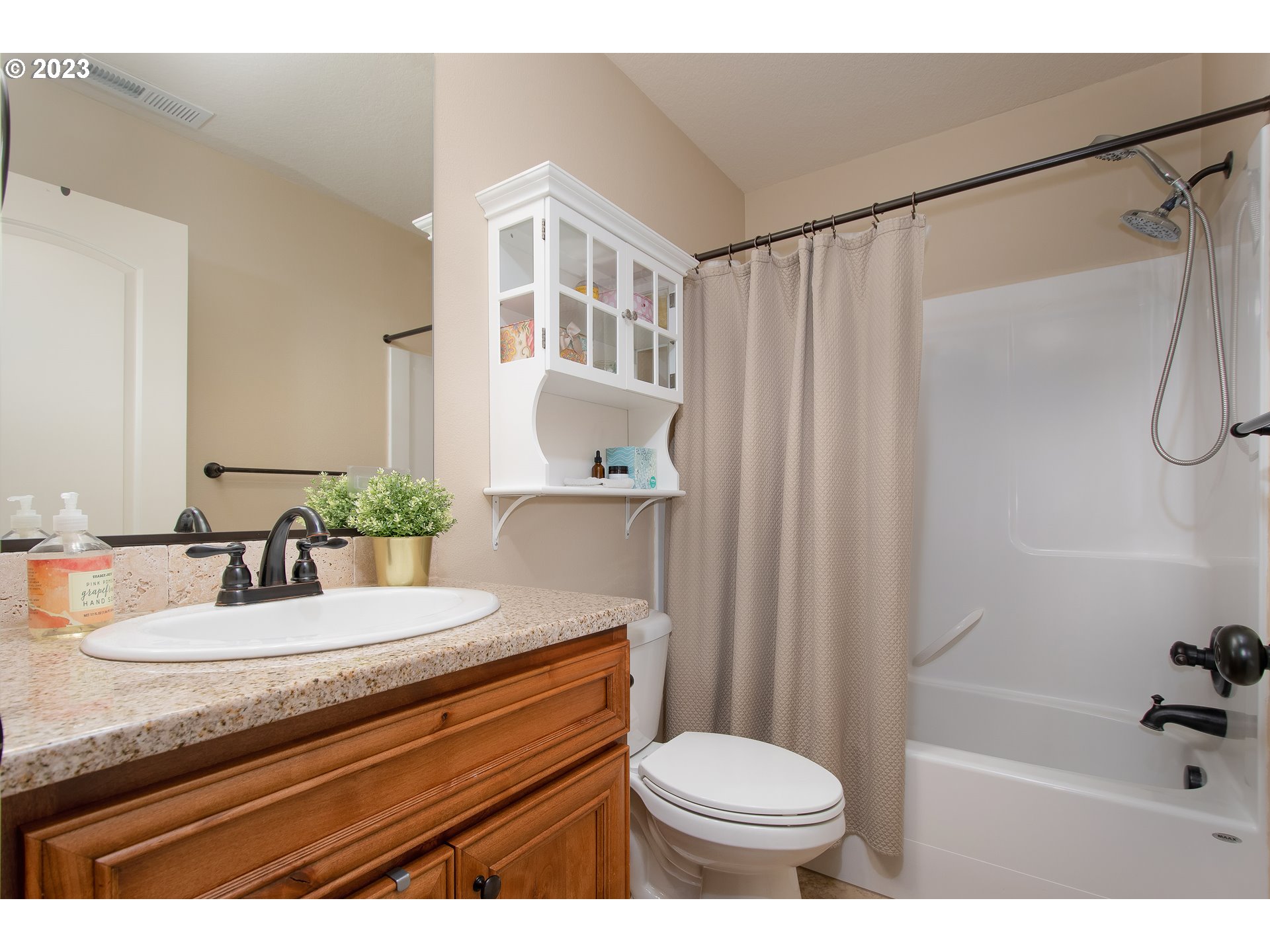 3309 North 3rd Street Ridgefield, WA 98642 - Photo 26 of 36 a bathroom with a sink a toilet and shower