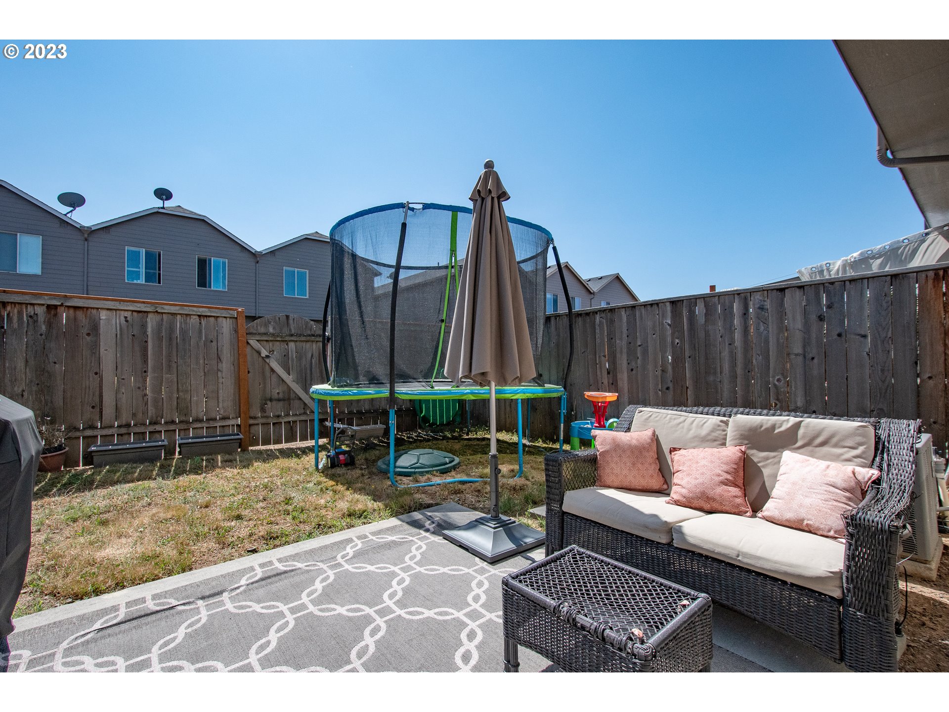 3309 North 3rd Street Ridgefield, WA 98642 - Photo 34 of 36 a backyard of a house with table and chairs