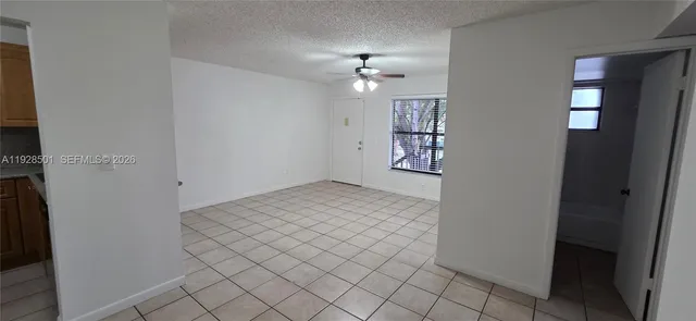 wooden floor in an empty room and a window