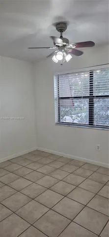 a view of wooden floor and chandelier in a room