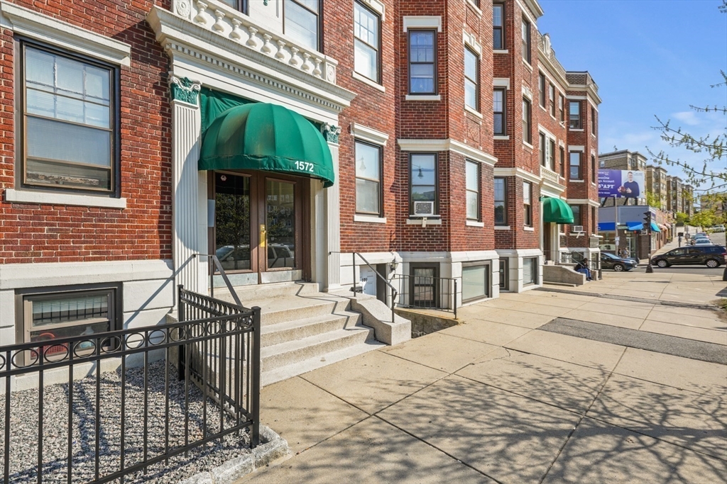 1572 Commonwealth Avenue, Unit 3 Boston, MA 02135 - Photo 6 of 6 a view of a building with a bench in front of building