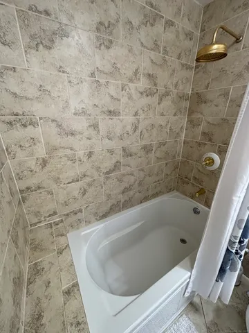 a bathroom with a bathtub