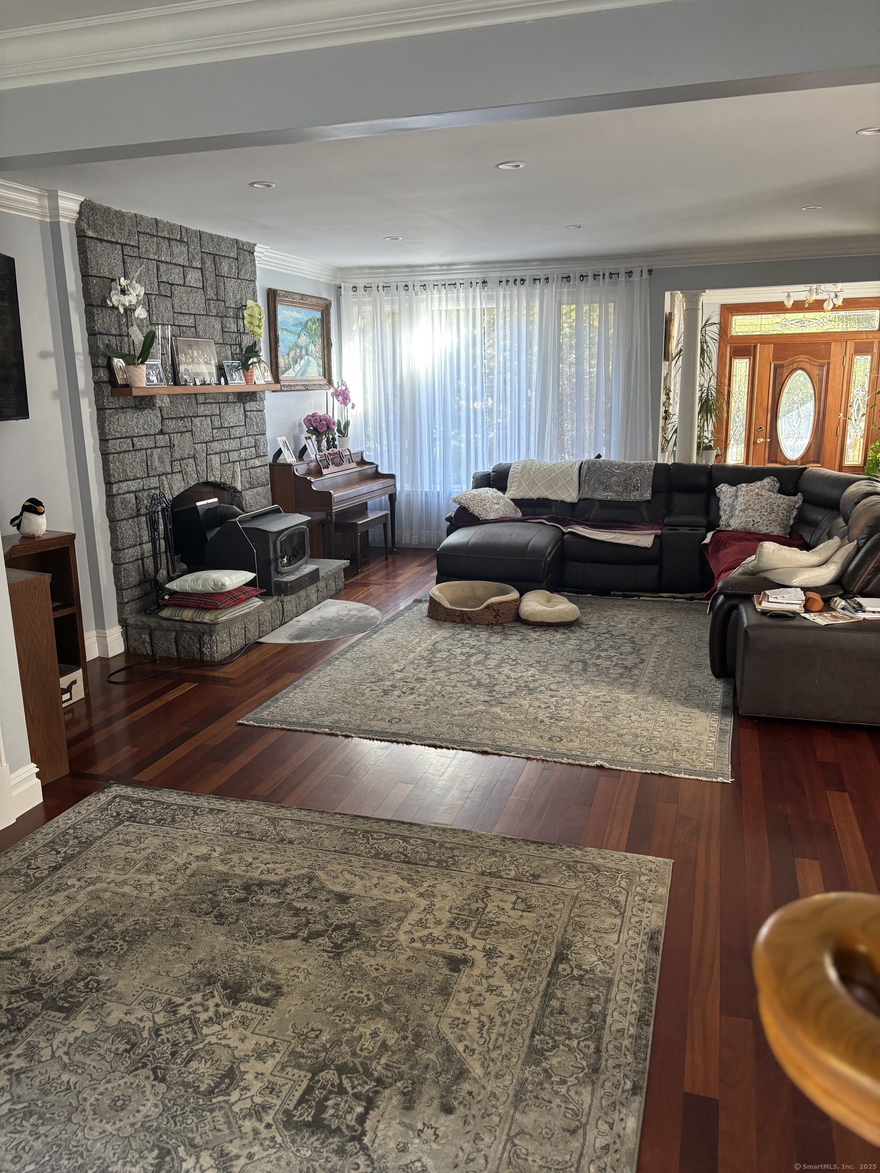 26 Olmstead Road Redding, CT 06896 - Photo 4 of 18 a living room with furniture and a fireplace
