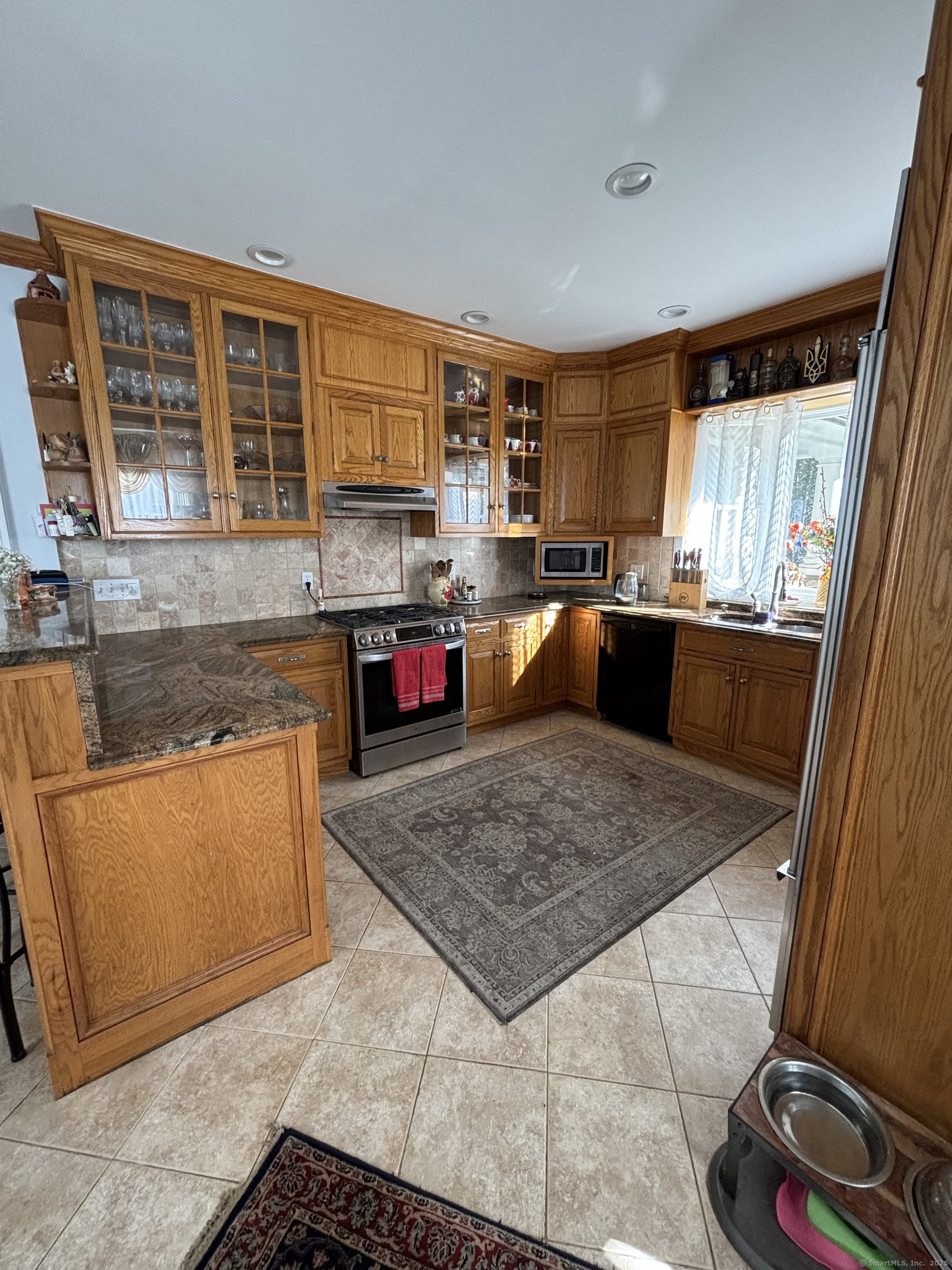 26 Olmstead Road Redding, CT 06896 - Photo 8 of 18 a living room with furniture and a flat screen tv