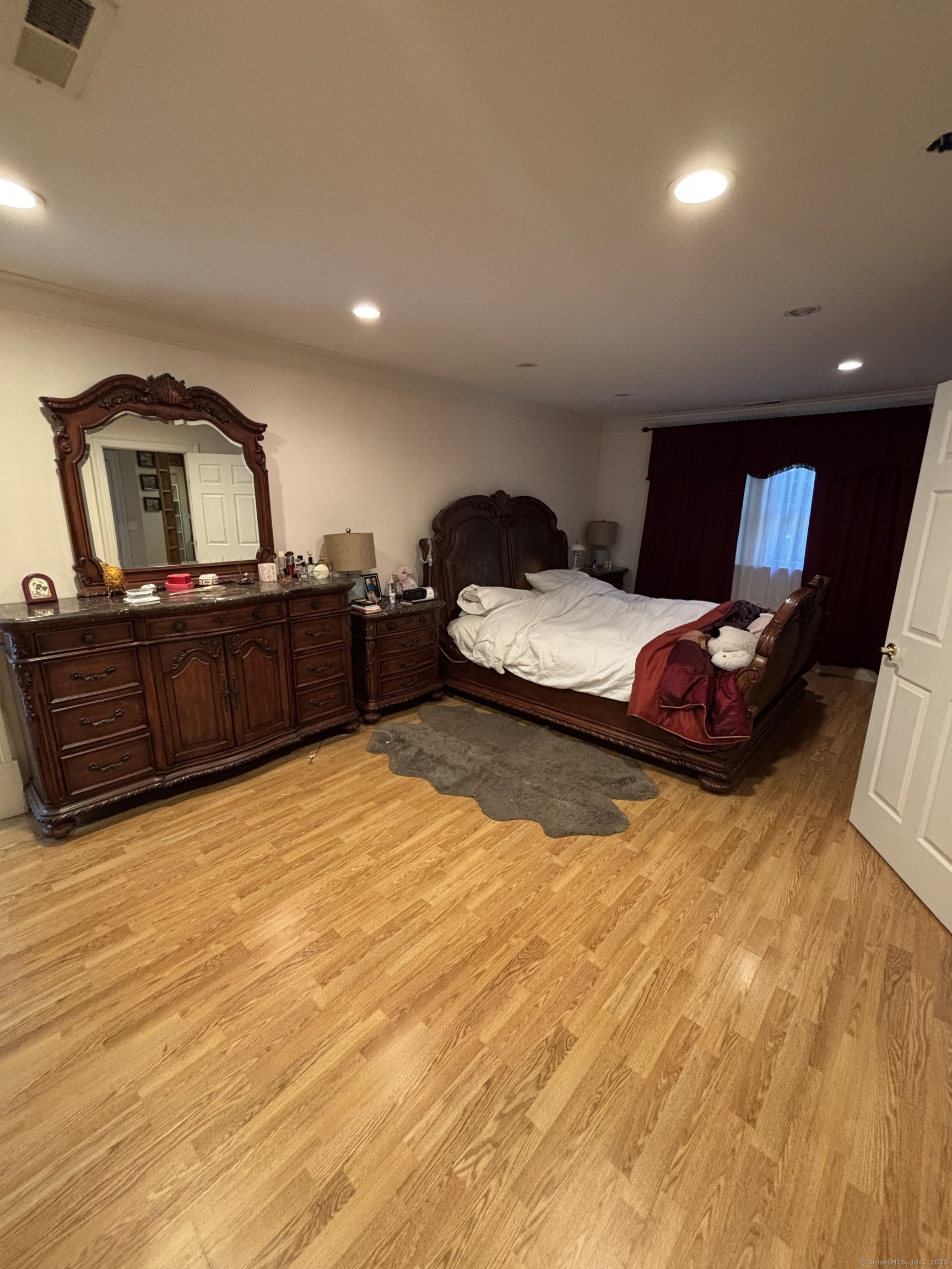 26 Olmstead Road Redding, CT 06896 - Photo 9 of 18 a bedroom with a bed and dresser