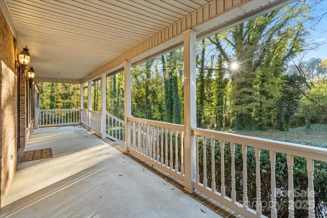 a view of hallway with wooden floor