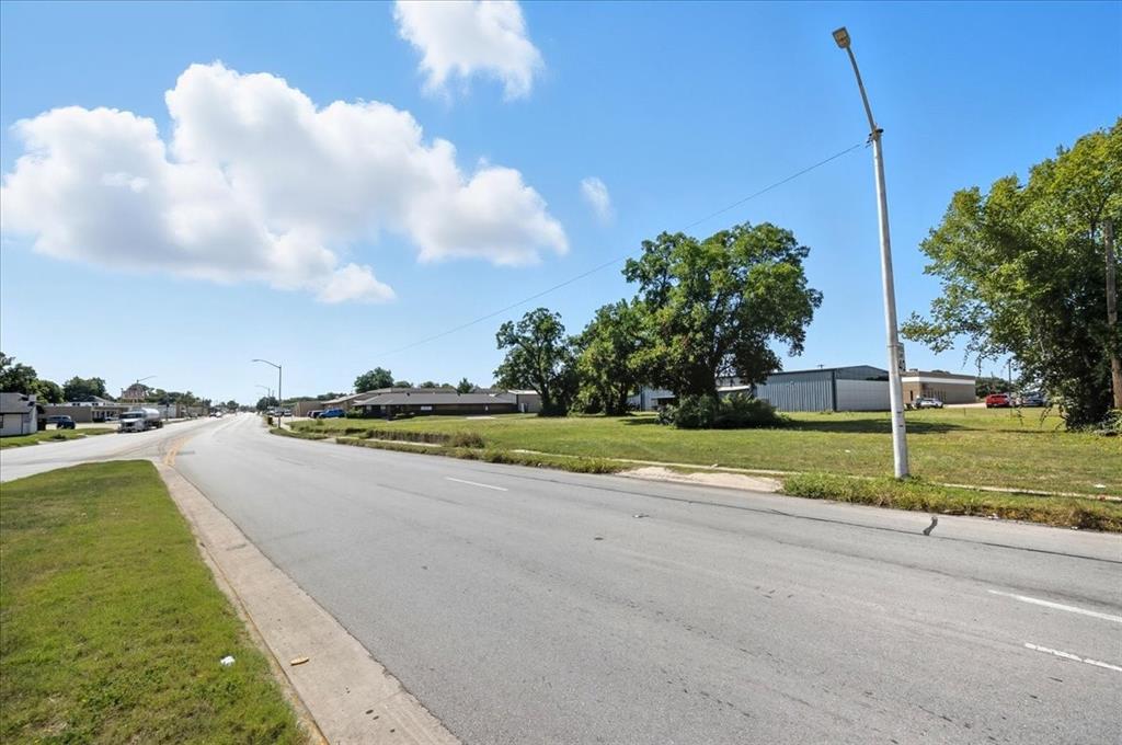 201 North Riverside Drive Fort Worth, TX 76111 - Photo 6 of 15 a view of a house with swimming pool and yard