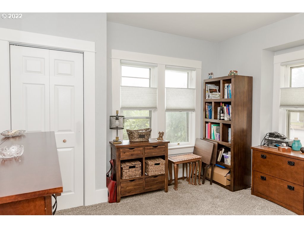 904 E Street Springfield, OR 97477 - Photo 11 of 31 a room with furniture a bookshelf and a window
