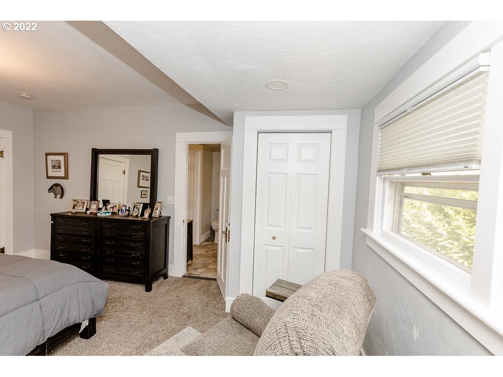 904 E Street Springfield, OR 97477 - Photo 15 of 31 a bed room with a bed and a window