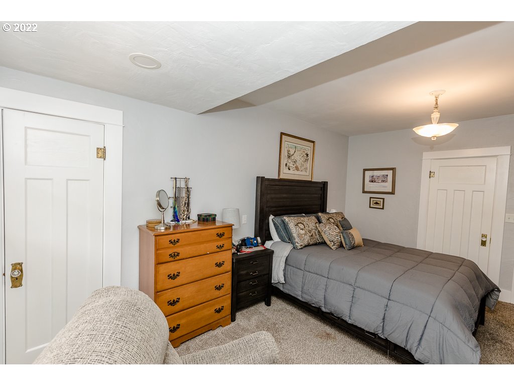 904 E Street Springfield, OR 97477 - Photo 16 of 31 a bedroom with a bed and furniture