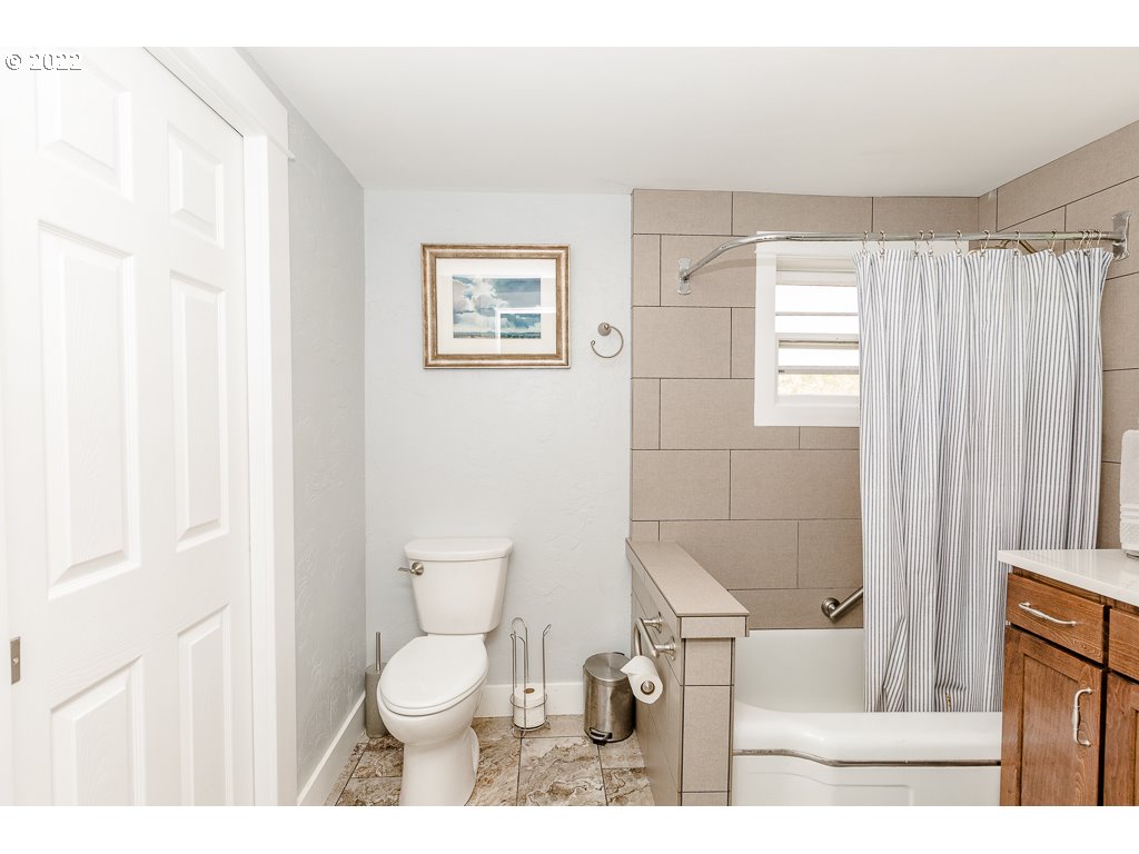 904 E Street Springfield, OR 97477 - Photo 19 of 31 a bathroom with a toilet a sink and a shower