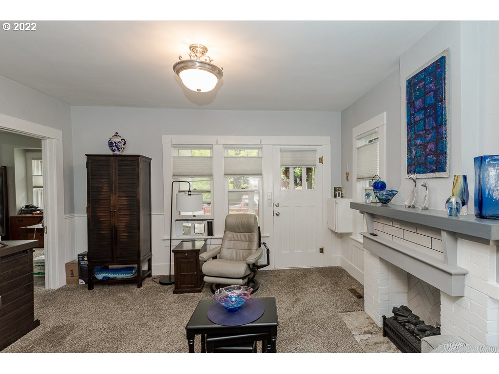 904 E Street Springfield, OR 97477 - Photo 2 of 31 a living room with furniture and a chandelier