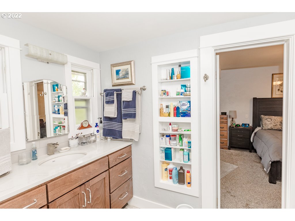 904 E Street Springfield, OR 97477 - Photo 21 of 31 a bathroom with a sink a vanity and a mirror