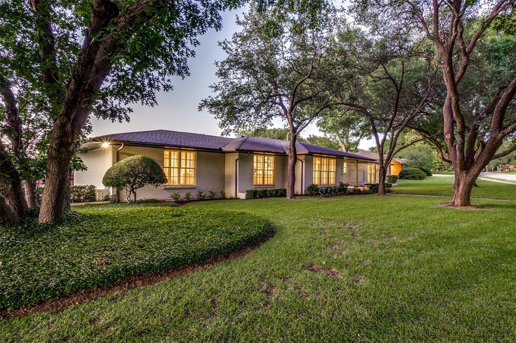 7009 Eudora Drive Dallas, TX 75230 - Photo 1 of 1 a front view of a house with a yard
