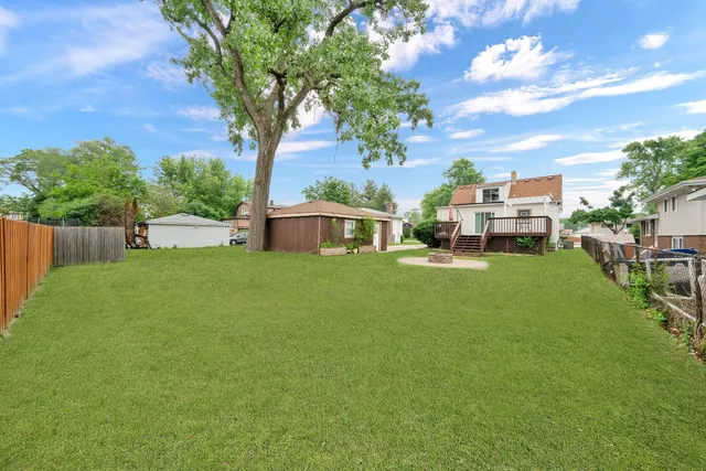 a view of a house with a yard porch and sitting area