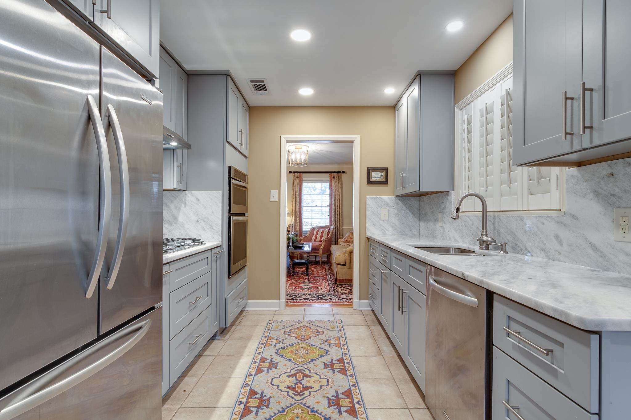 286 North Perkins Road Memphis, TN 38117 - Photo 6 of 25 a kitchen with stainless steel appliances granite countertop a refrigerator and a sink