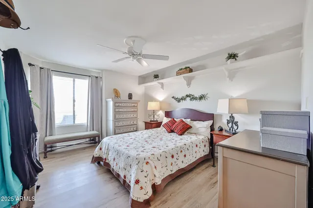 a bedroom with a large bed and a window