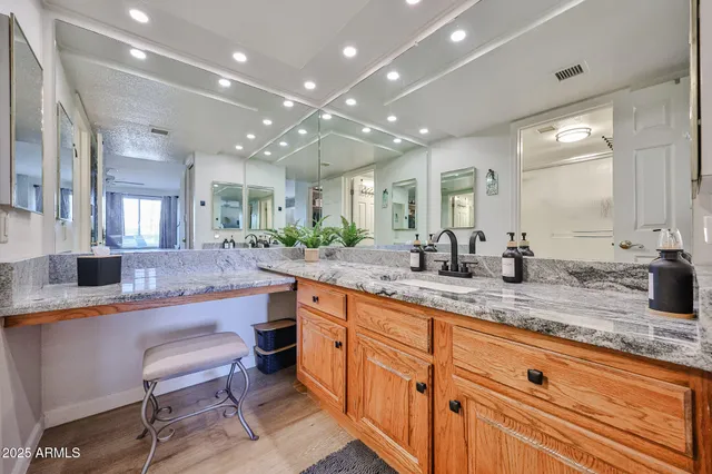 a large kitchen with lots of counter space and sink