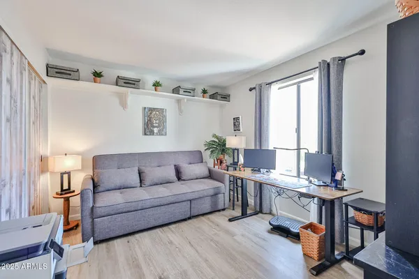 a living room with furniture and a window